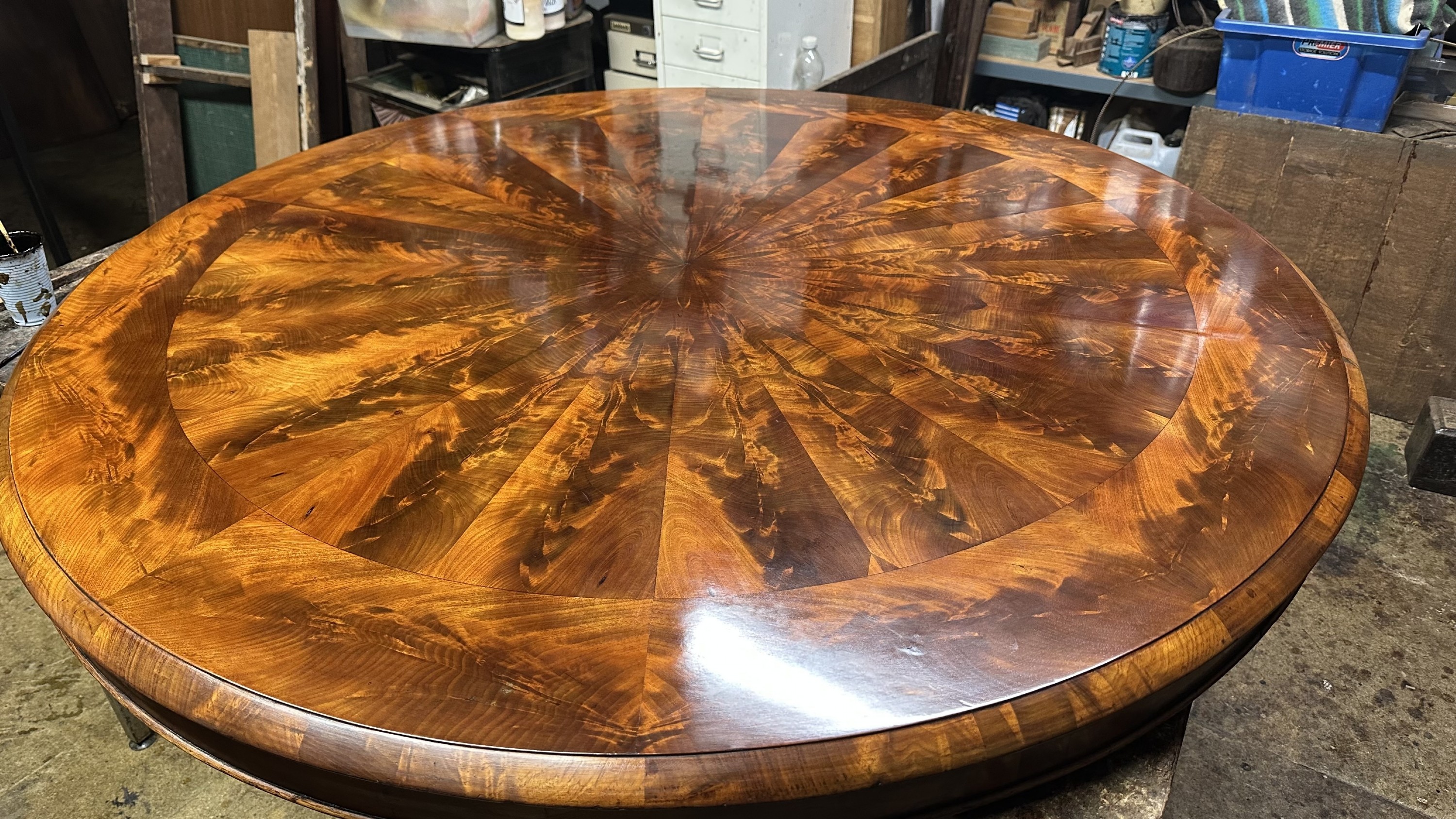 recent restoration to a william iv mahogany radial veneered centre table