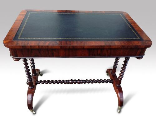 an early victorian rosewood writing table