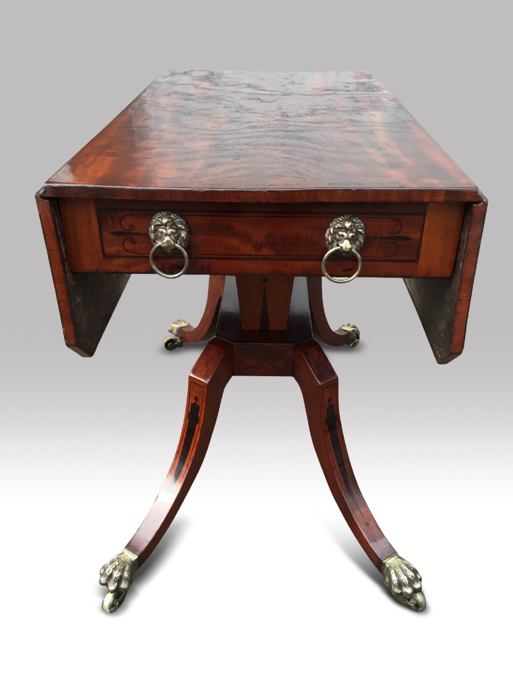 a fine regency mahogany and ebony inlaid drop leaf sofa table