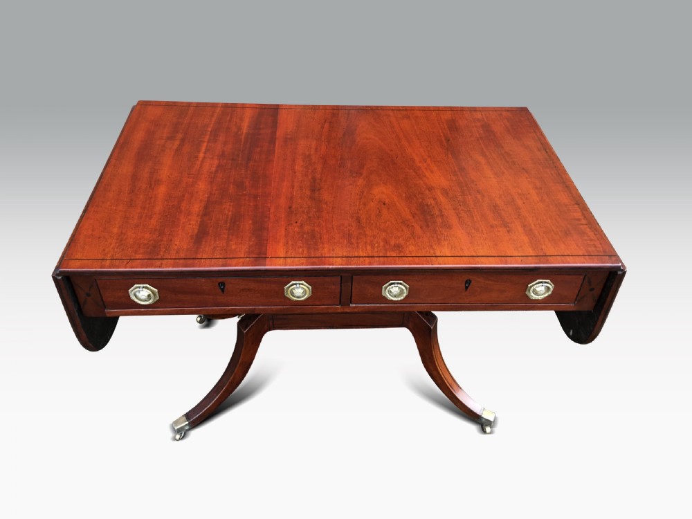a fine regency mahogany ebony inlaid sofa table