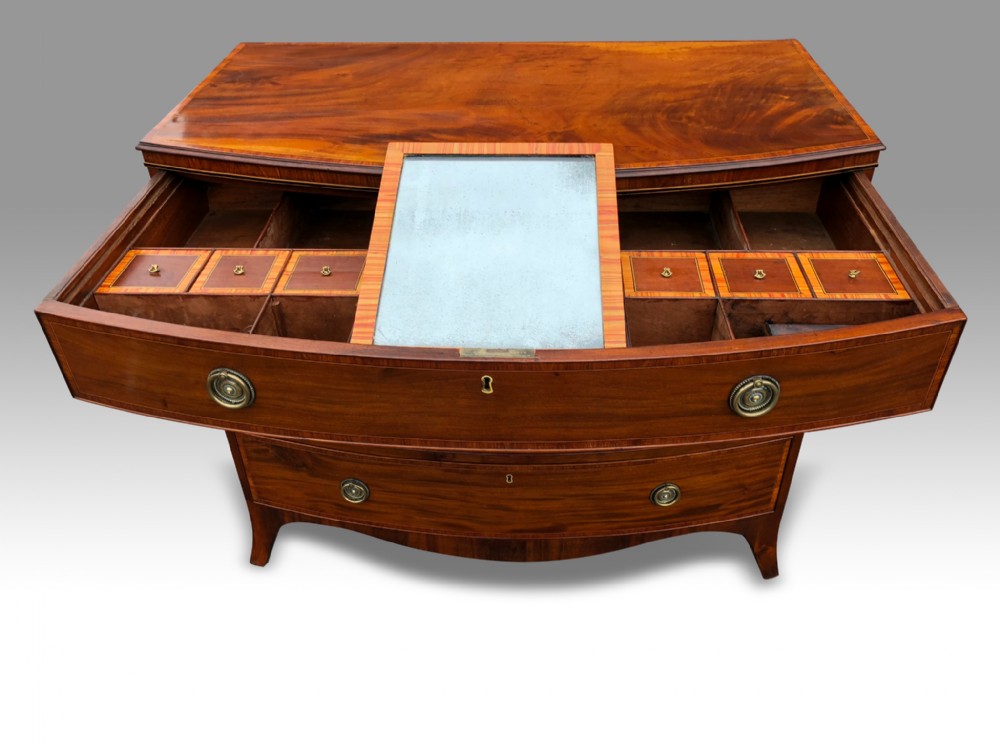 a superb george iii mahohany tulipwood banded bowfront dressing chest