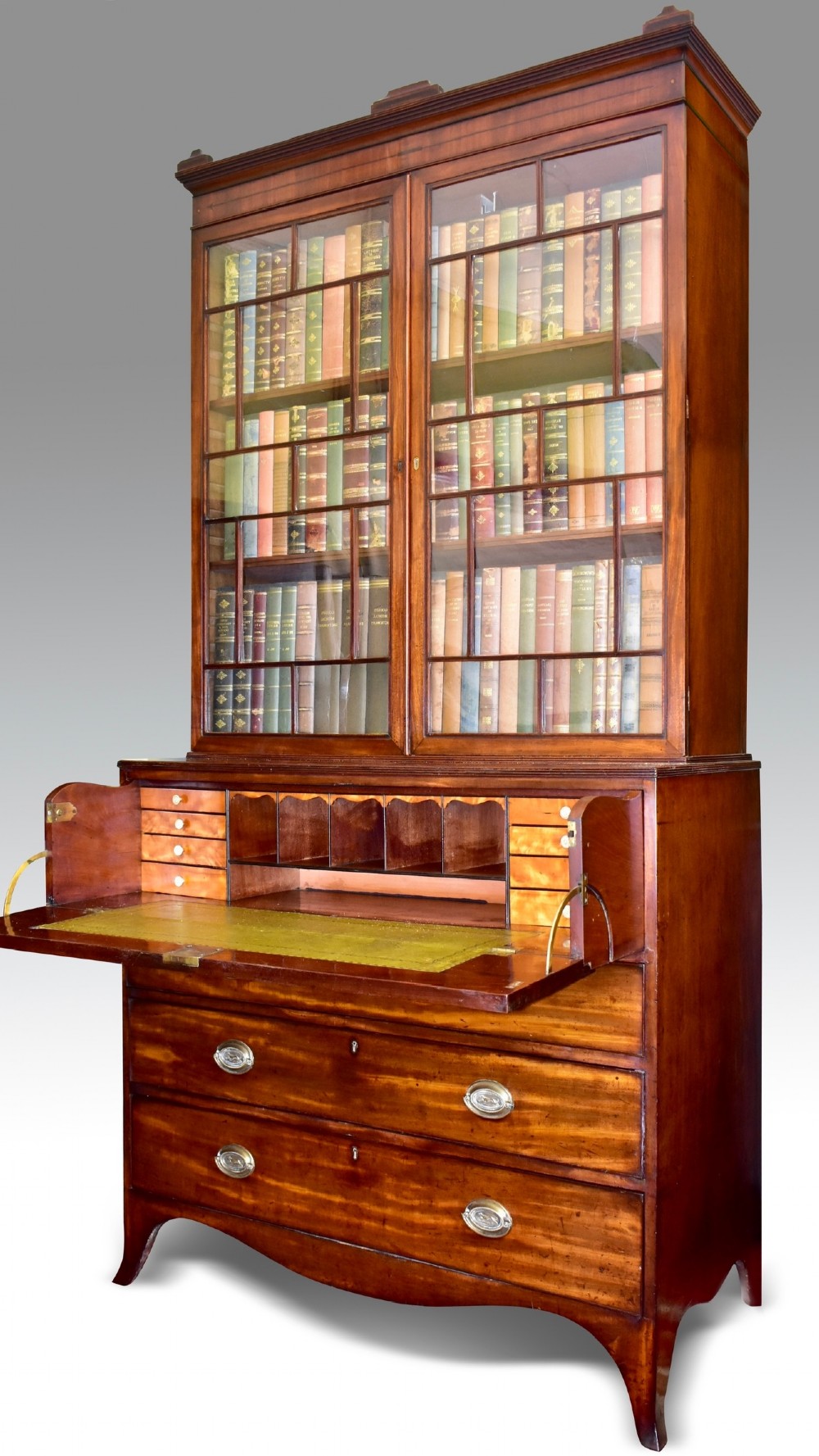 a fine regency mahogany ebony inlaid secretaire bookcase