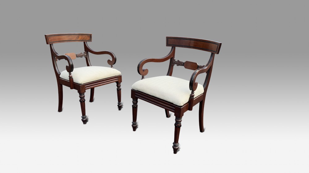 a pair of regency mahogany ebonised armchairs
