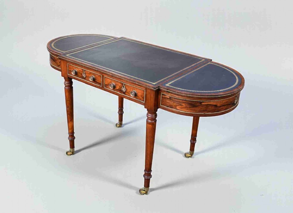 regency rosewood brass mounted writing table attributed to gillows